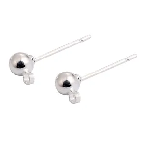 Close-up detail of silver ball stud earring pins with hanging loops for DIY jewelry crafting.