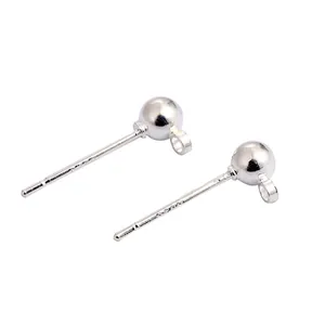 Macro detail of silver-plated ball stud earring components with loops for DIY jewelry making projects