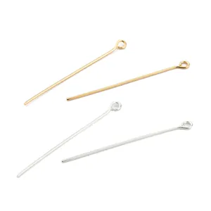Detail view of 18K gold and silver plated copper eye pins for jewelry making
