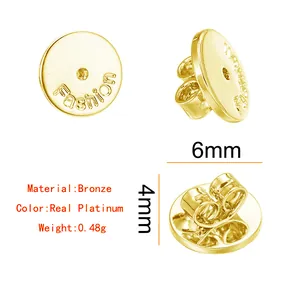 Detailed macro view of 6mm circular bronze earring backs with platinum finish and dimensions