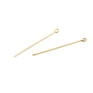 Close-up of 18K gold plated eye pins for DIY jewelry making findings project