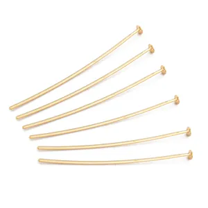 Close-up of 18K gold plated copper T-pins for handmade DIY jewelry making findings.