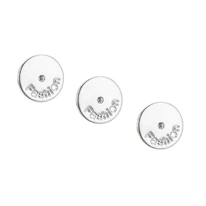 Close-up detail of silver-plated round earring backs with Fashion engraving for DIY jewelry