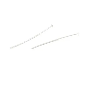 Detailed view of two silver-plated copper flat head T-pins for DIY jewelry craft projects