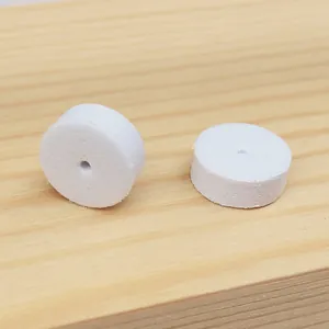 Macro view of white round foam spacers used for jewelry card needle protection and stabilization