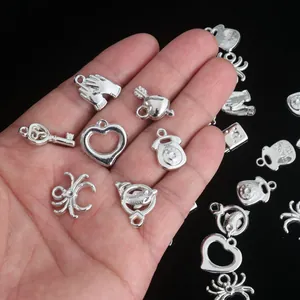 Detailed macro shot of assorted silver CCB charm pendants for creative DIY jewelry making projects