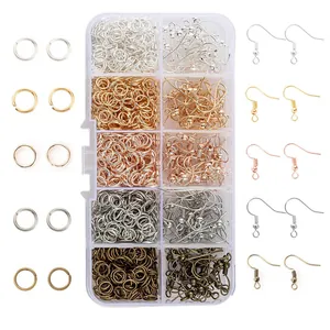 Assorted DIY jewelry making kit with earring hooks and jump rings in a storage box.