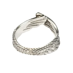 Detailed view of vintage adjustable silver-toned angel wing ring with feather texture