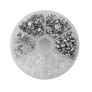 Detailed view of assorted earring backs and nuts in a six-compartment organizer box