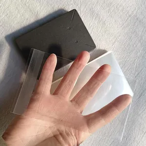 Details of clear self-sealing plastic bag and black display card for jewelry packaging.