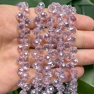 Close-up detail of 6mm light purple faceted crystal strawberry beads for DIY jewelry making