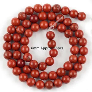 Close-up of 6mm round red jasper natural stone loose beads for DIY jewelry making