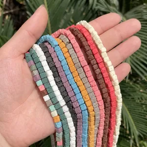 Macro close-up of colorful 4x4mm square lava stone beads for DIY jewelry making