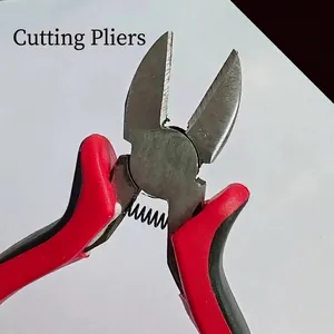 Detailed close-up of red and black handle diagonal cutting pliers for jewelry making