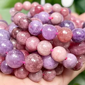 Close-up of polished colorful angelite round beads with natural mineral textures