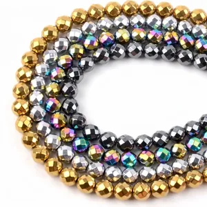 Detail of faceted hematite beads in gold silver and iridescent colors