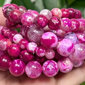 Macro view of rose red dragon vein fire agate beads with unique natural patterns
