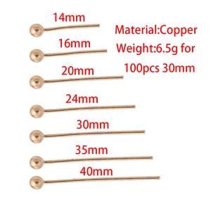 Close-up of gold-plated copper ball head pins in multiple sizes for DIY jewelry making.