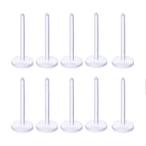 Detailed view of ten transparent plastic flat-bottom earring pins for DIY jewelry crafts