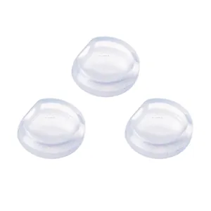 Detailed close-up of three soft transparent silicone anti-pain pads for clip-on earrings