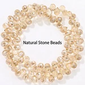 Macro shot of sparkling 6mm amber faceted teardrop crystal beads for jewelry making