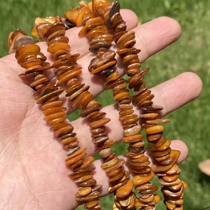 Close-up detail of irregular brown shell beads for DIY jewelry crafting
