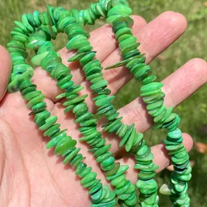 Close-up detail of vibrant green crushed shell beads 7-14mm for DIY jewelry making