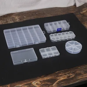 Collection of various transparent plastic storage boxes for jewelry and hardware parts