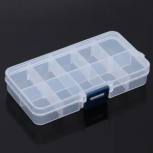 Detail view of a clear plastic storage box with adjustable dividers and a blue latch.