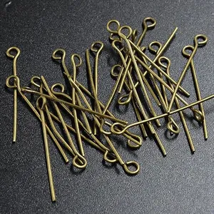 Detailed macro shot of antique bronze eye pins for DIY jewelry making and beading