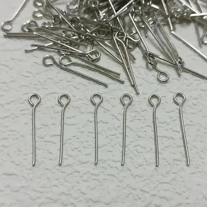 Macro detail of silver plated eye pins for DIY jewelry making and handmade beadwork