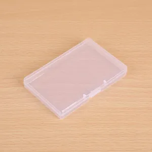 Detailed view of a clear plastic storage box with secure snap closure on wood background