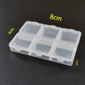 Detailed view of 6-compartment transparent plastic organizer box with dimensions 8x6x1.4cm
