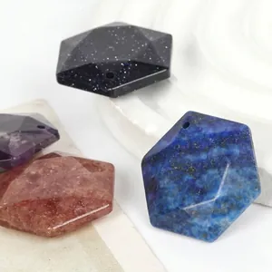 Detail view of hexagonal faceted lapis lazuli and amethyst stone pendants