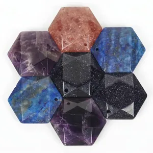 Close-up detail of hexagonal faceted natural stone pendants for DIY jewelry making and crafts