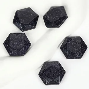 Detailed view of hexagonal faceted blue goldstone pendants with a shimmering starry effect