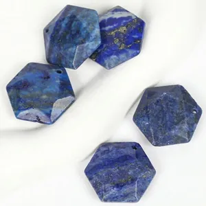Detailed macro view of faceted hexagonal lapis lazuli stone pendants for DIY jewelry making