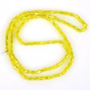 Detailed view of 2x4mm yellow faceted glass spacer beads for DIY jewelry making.