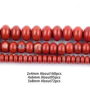 Close-up of natural red jasper stone beads in three sizes for DIY jewelry making