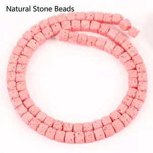 Detailed macro view of pink 4x4mm square lava stone beads for jewelry DIY
