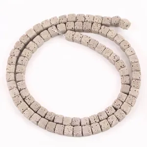 Detailed close-up view of 4x4mm square grey lava stone beads for DIY jewelry making
