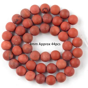 Macro detail of 8mm natural red stone round beads for DIY handmade bracelet jewelry making