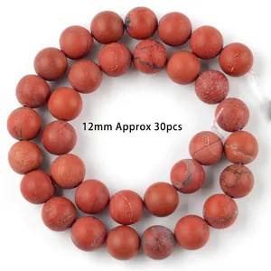 Macro view of 12mm red jasper natural stone beads for DIY jewelry making crafts