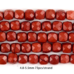 Detailed close-up of faceted red jasper natural stone beads for DIY jewelry making