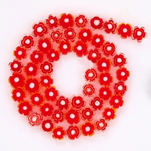 Close-up of 8mm red plum blossom lampwork glass beads for DIY jewelry making accessories