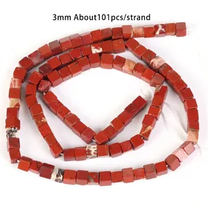 Close-up detail of 3x3mm square red jasper natural stone beads for DIY jewelry making