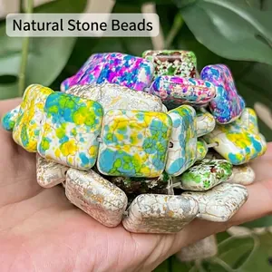 Detail view of 20mm multicolored flat square turquoise beads for DIY jewelry making.