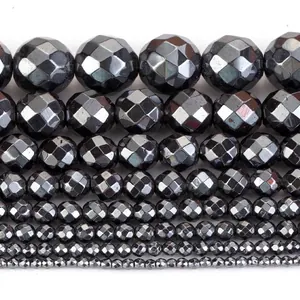 Detailed close-up of faceted hematite beads in various sizes for DIY jewelry making