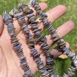 Macro view of natural bohemian crushed shell beads for artisanal jewelry DIY crafts