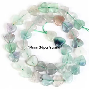 Detailed view of 10mm natural heart-shaped fluorite beads strand for DIY jewelry